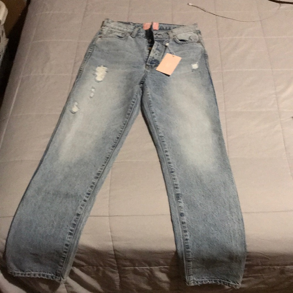 Distressed denim jeans